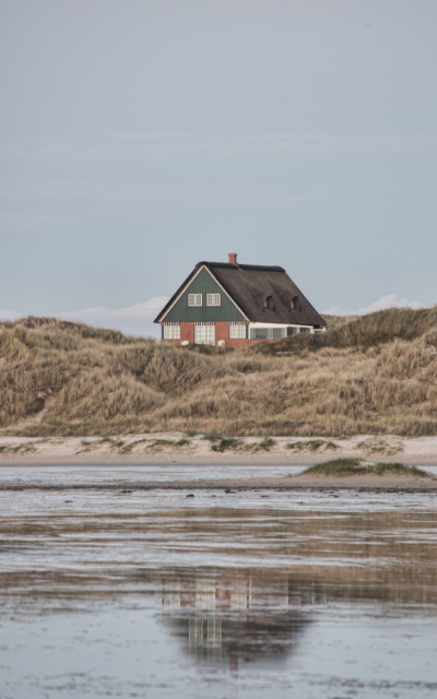 vertical-shot-small-isolated-house-shore-sea